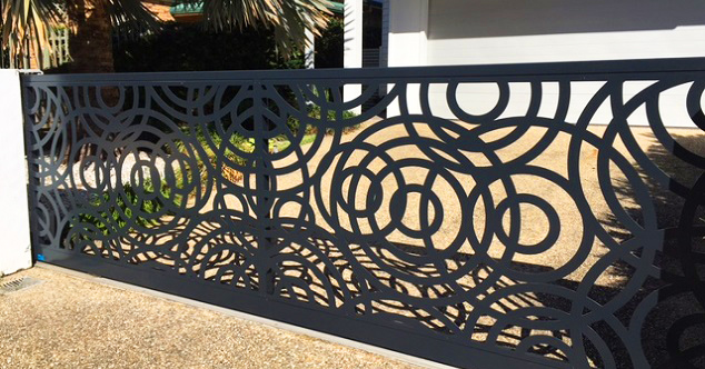 alt=" Black Steel Fence With Intricate Circle Pattern